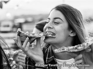 624028110-Eating pizza at a party on the roof