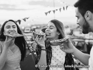 624028110-Eating pizza at a party on the roof